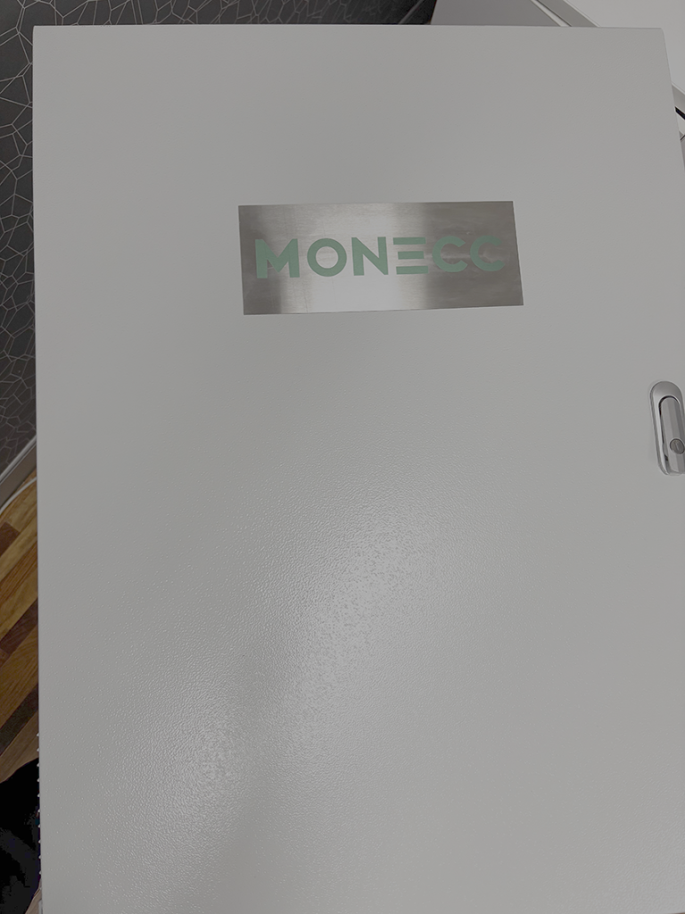 Monecc branded electrical enclosure used for energy monitoring system deployment.