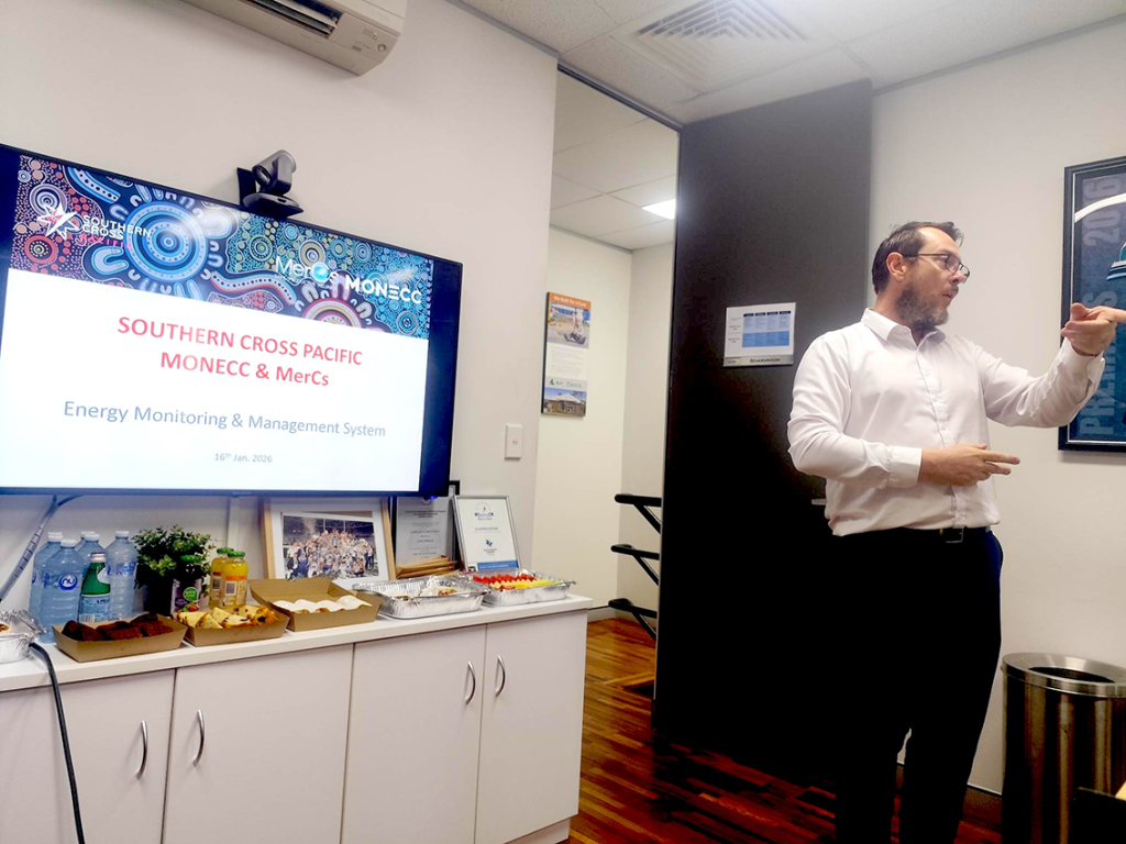 Presenter delivering energy monitoring and management system briefing at Southern Cross Pacific.